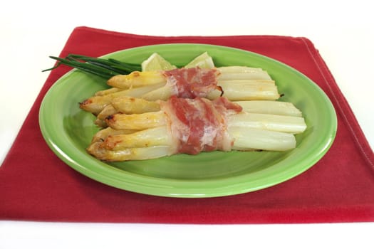 white asparagus with ham baked in the oven