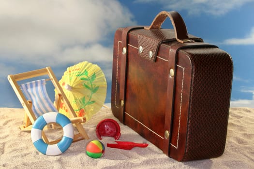 Deck chair and sun umbrella on a sandy beach