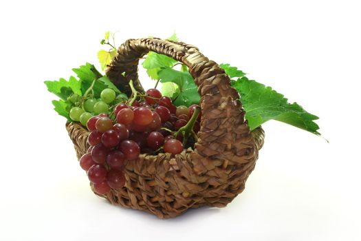 Grapes and vine leaves in a basket