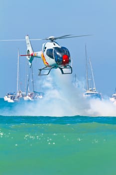 CADIZ, SPAIN-SEP 11: Helicopters of the Patrulla Aspa taking part in an exhibition on the 4th airshow of Cadiz on Sep 11, 2011, in Cadiz, Spain