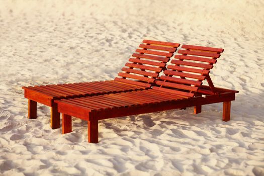 The beach belongs to relax - wooden sunbed