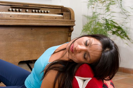 Hispanic woman  in an indoors location, dreaming