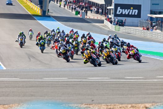 JEREZ DE LA FRONTERA, SPAIN - APR 17: Motorbike competitors begin the Moto2 race in the CEV Championship on April 17, 2011 in Jerez de la Frontera, Spain.