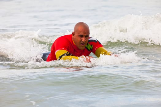 SAN FERNANDO, CADIZ, SPAIN - FEB 19: Unknown bodyboader taking waves on the 2nd championship of Surf and BodyBoard Impoxibol on Feb 19,2011 on the beach of Camposoto of San Fernando, Cadiz, Spain