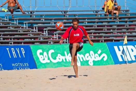 CADIZ, SPAIN -  JUL 30:  Unknown player of the team of Gijon playing the Spanish Championship of Beach Soccer on Jul 30, 2005 on the beach of La Victoria in Cadiz, Spain