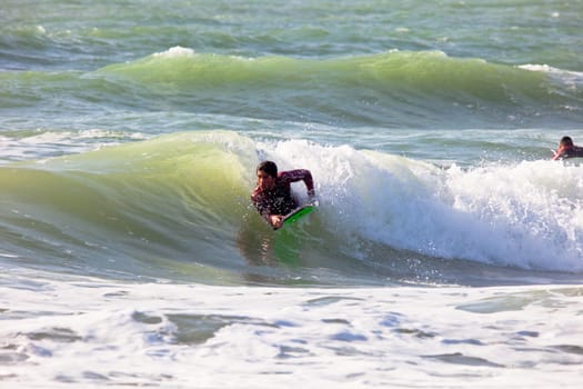 SAN FERNANDO, CADIZ, SPAIN - FEB 19: Unknown bodyboader taking waves on the 2nd championship of Surf and BodyBoard Impoxibol on Feb 19,2011 on the beach of Camposoto of San Fernando, Cadiz, Spain