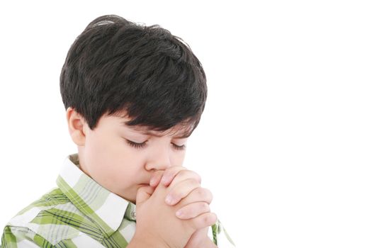 A boys prays earnestly to his creator in heaven