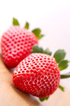 Closeup of ripe strawberries on wooden background