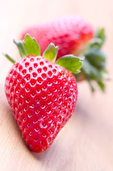 Closeup of ripe strawberries on wooden background