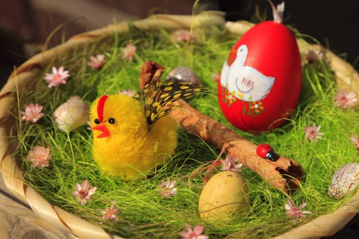 Beautiful easter wooden basket containing many items.