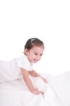 cute little girl on the bed at home