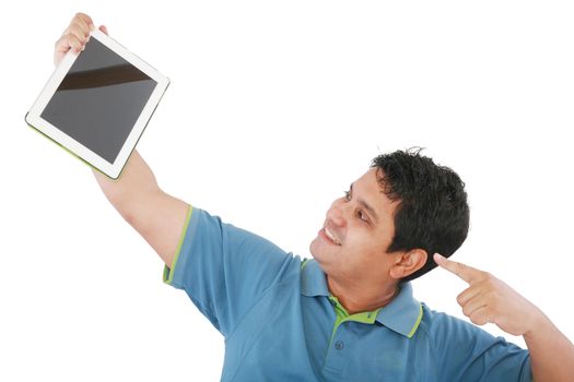 Laughing casual young man holding a touch pad tablet pc on isolated white background