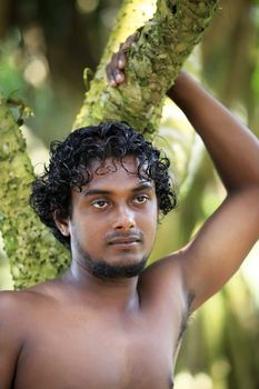 Portrait young men on a green background. Sri Lanka