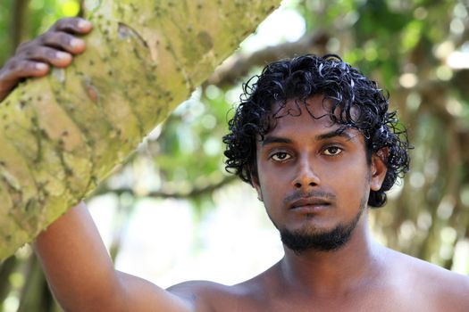 Portrait young men on a green background. Sri Lanka