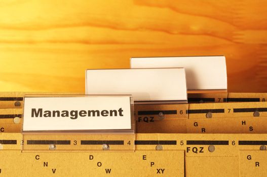 management word on business office folder showing leadership concept