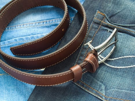 Leather fashion belt with blue jeans