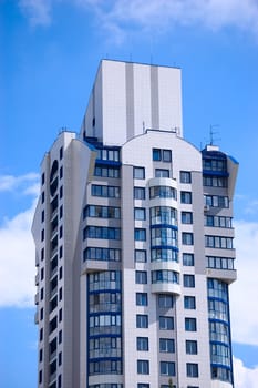 Modern office building on blue sky background