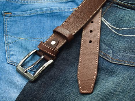 Leather fashion belt with blue jeans