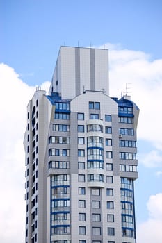 Modern office building on blue sky background