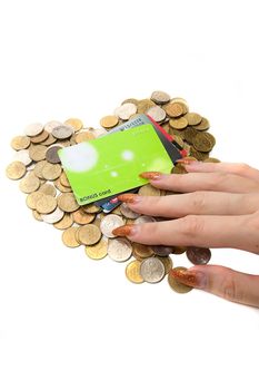 Female hand, coins and cards on white