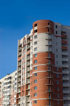 High multistory house of red and white bricks 