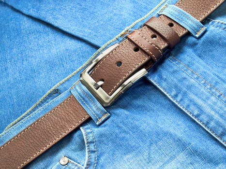 Leather fashion belt with blue jeans