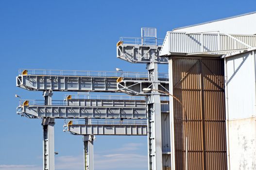 Detail of overhead cranes and warehouse in a shipyard