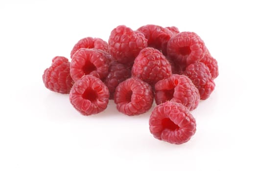 Bunch of raspberries on a white background.