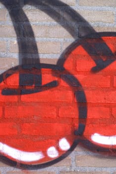 Graffiti, cherries on a wall.