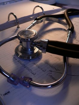 a stethoscope on a notebook