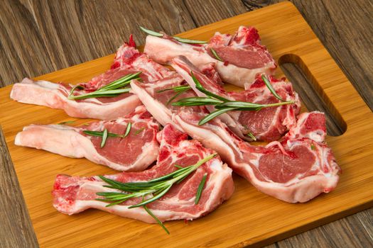 Racks of lamb, ready for cooking, with fresh rosemary