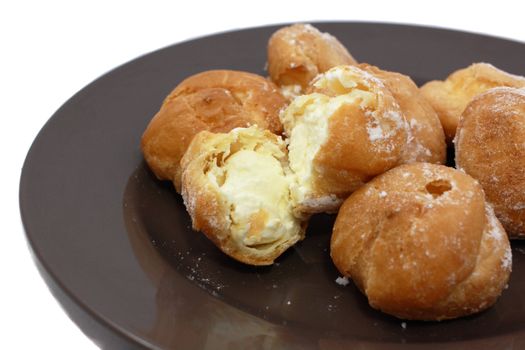 brewing cake with milky cream on the plate