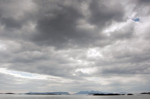 A big sky over the islands of Eigg and Rum from the beach at Arisaig, Scotland where the film Local Hero was made.