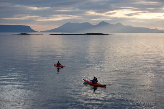 Canoes at arisaig, Scotland with the island of Rum in distance