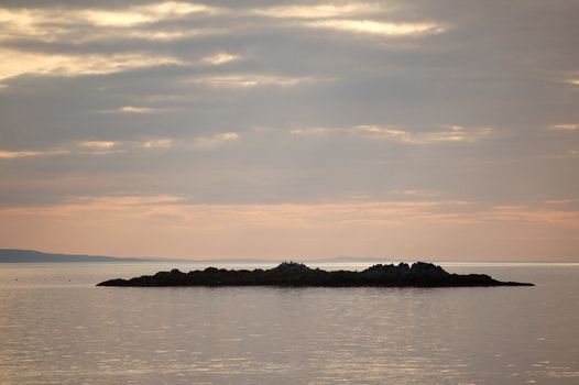 Sunset over a small island from Arisaig, Scotland