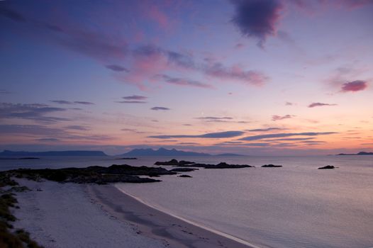 Sunset over Rum from Arisaig above the beach where Local Hero was filmed with a new moon visible in the sky