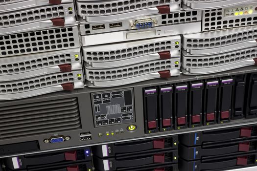 servers stack with hard drives in a datacenter for backup and data storage