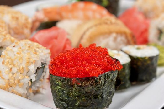 japanese sushi set with red tobiko sushi in the foreground