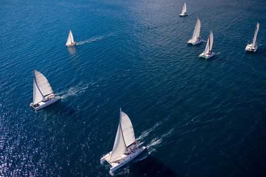 Regatta in indian ocean, sailboat and catamaran. Helicopter view