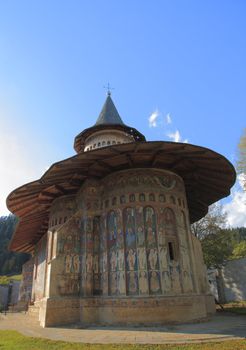 Image of Voronet Monastery,Moldavia,Romania.The frescoes at Voronet feature an intense shade of blue known in Romania as Voronet blue.It was built in 1488 by Stephen the Great and is one of the most famous painted monasteries from Moldavia.