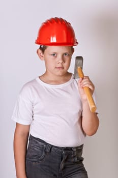 Portrait of a boy in a red protective helmet