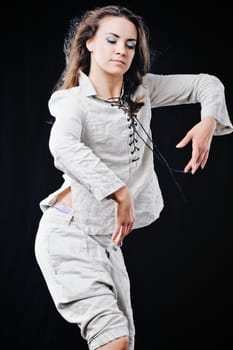 Young woman in white suit, Isolated on black background