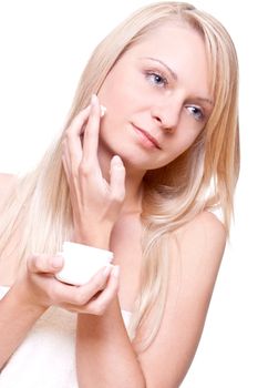 beautiful woman with cream on a white background