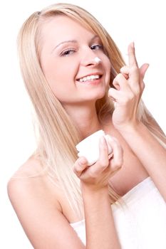 beautiful woman with cream on a white background