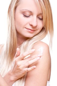 beautiful woman with cream on a white background