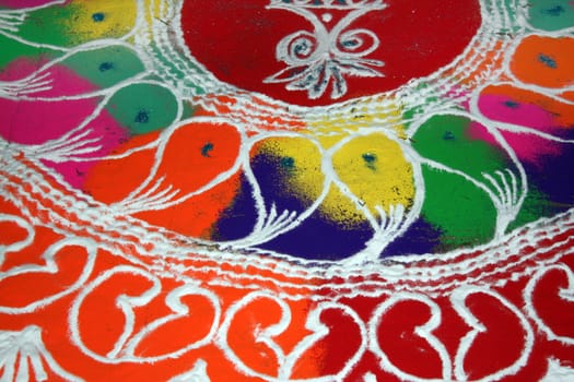 A beautiful design traditionally made of colorful powder on the occassion of Diwali festival in India.