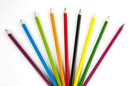 front view of color pencils over white background
