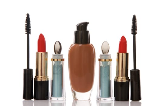 red lipstick and cosmetics on white background, beauty concept