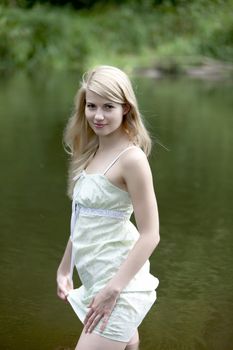 Young woman on a summer day in the river.