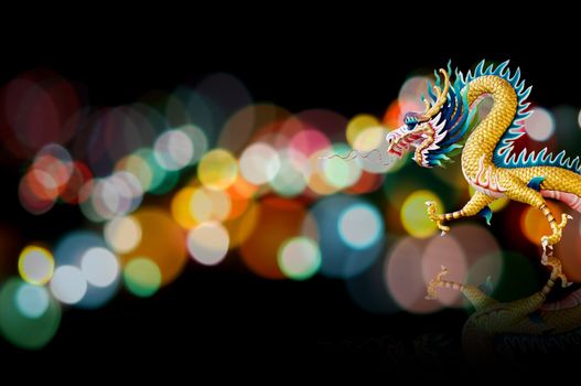 Dragon statue with nice lighting bokeh, Holiday background